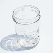 A clean empty glass jar.